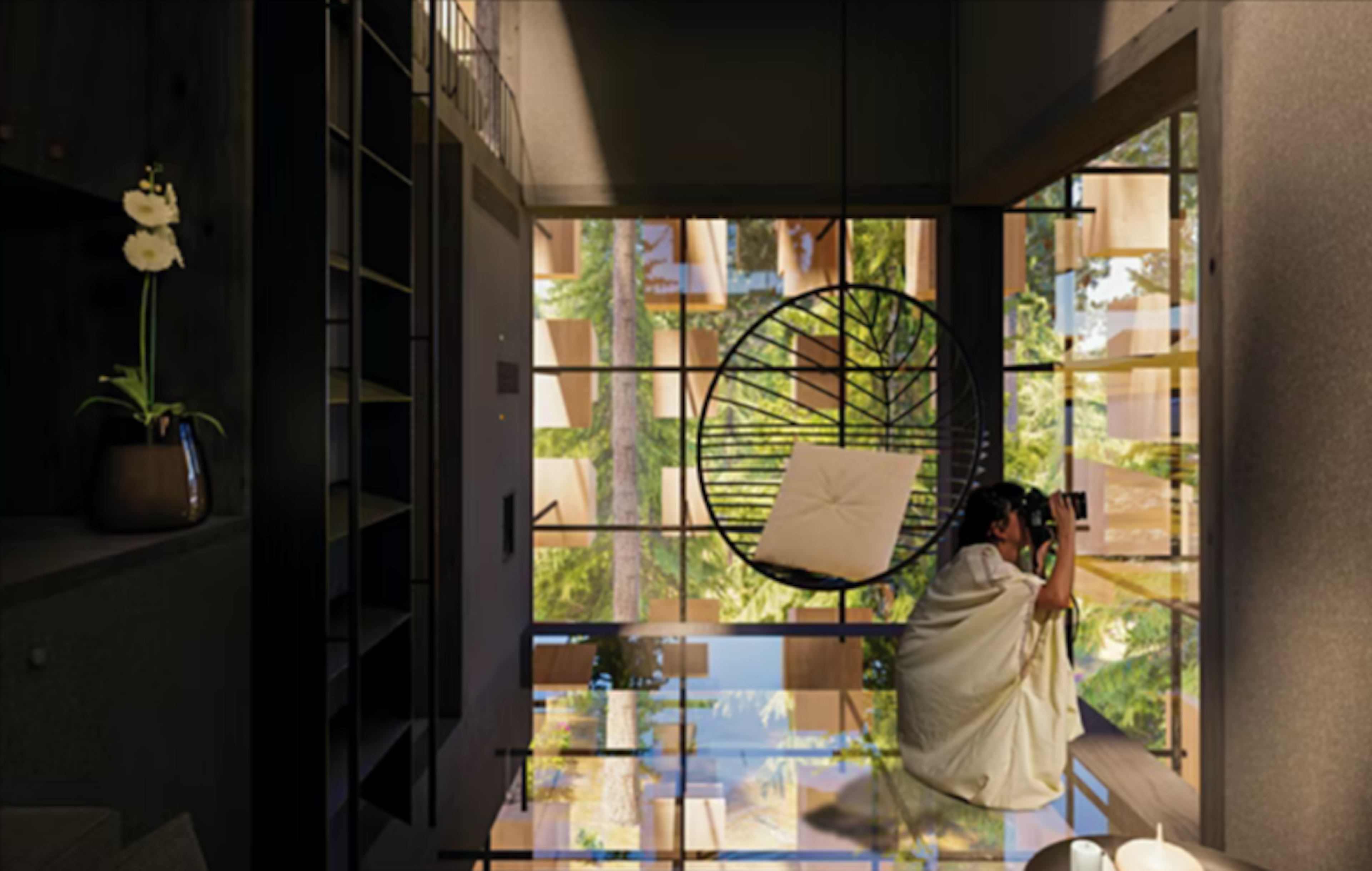 Woman enjoys view from Biosphere room through a pair of binoculars