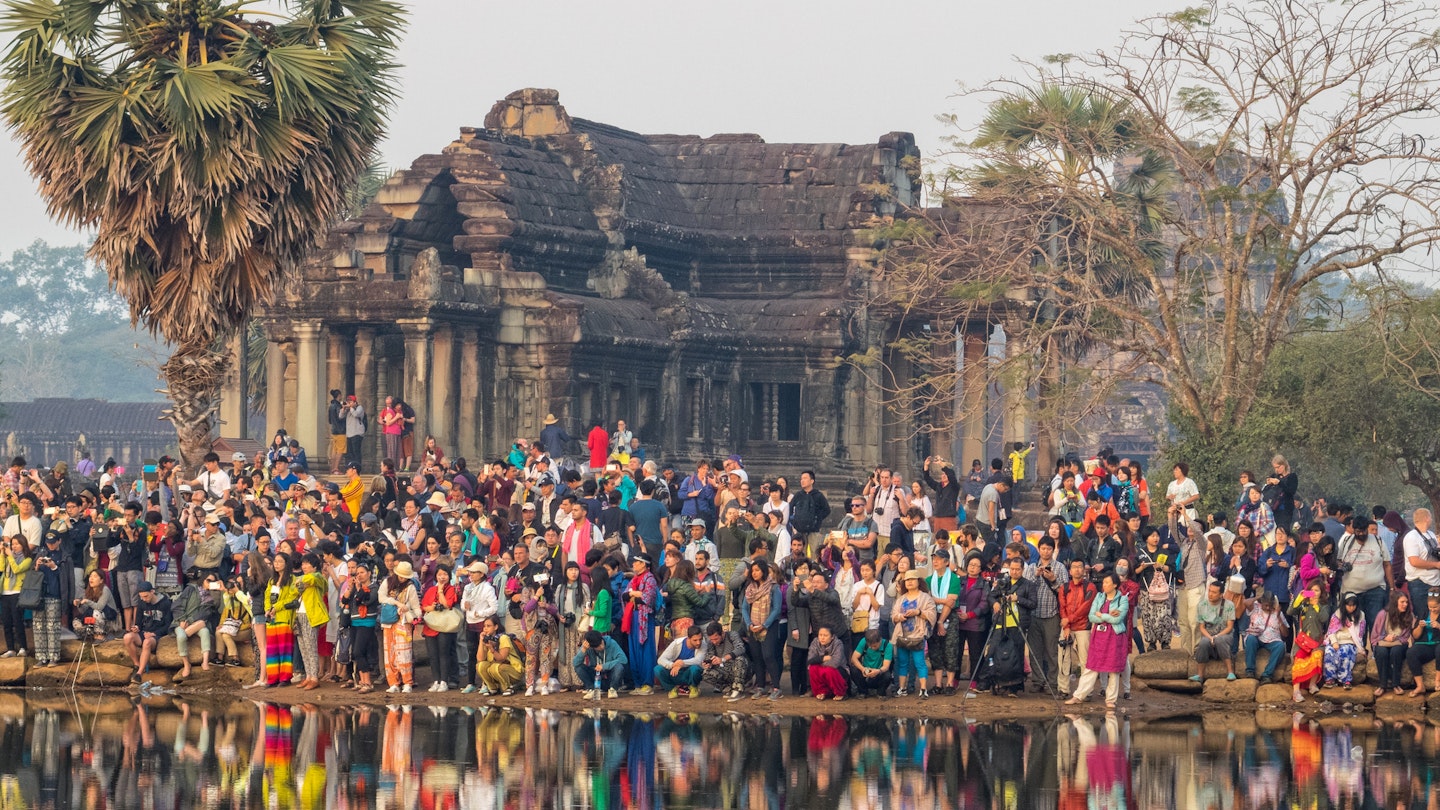 High season draws huge crowds for iconic photo opportunities like sunrise at Angkor Wat