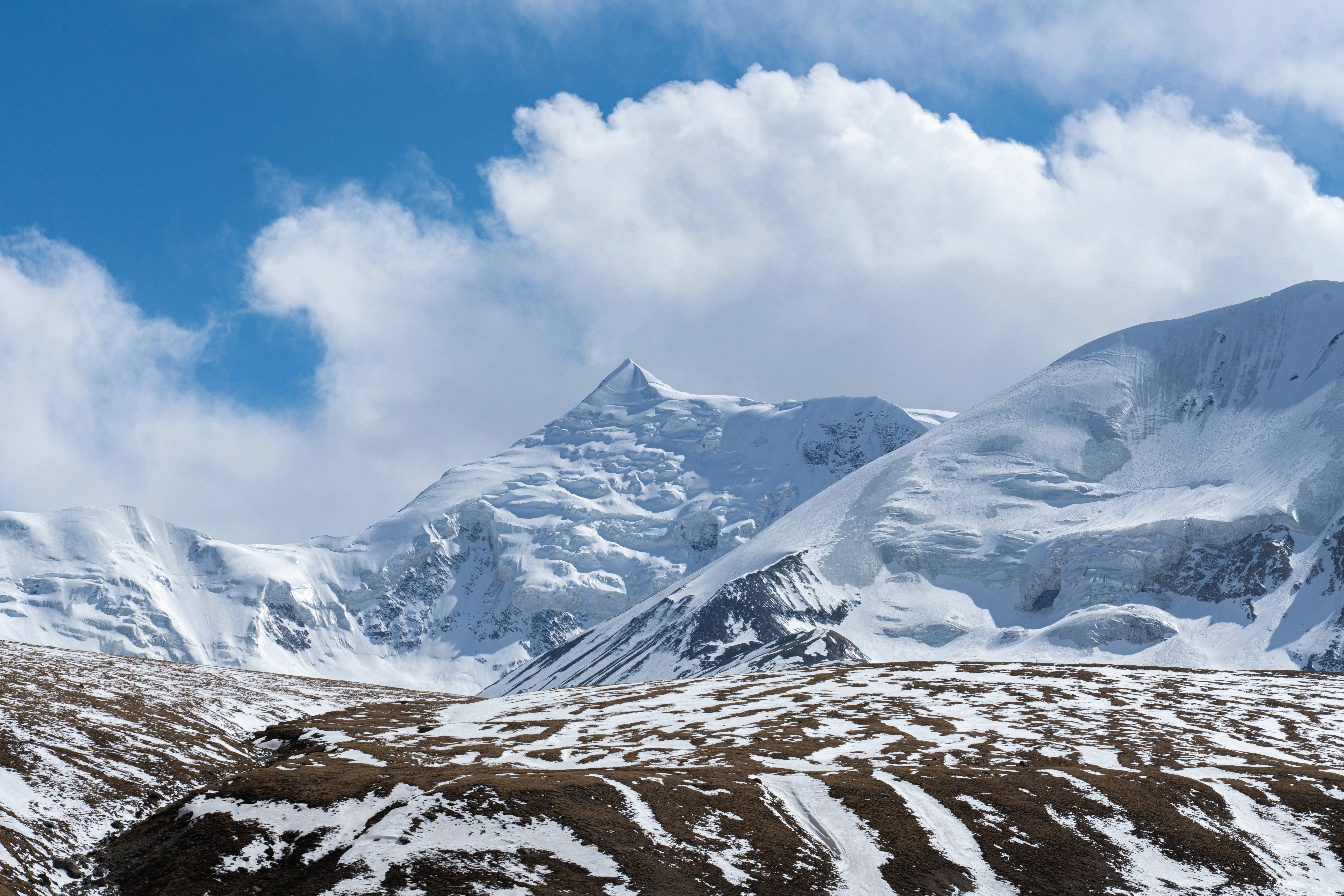 Close-up view of Mount Amnye Machen and its 6282m peak of Machen Kangri,   Amdo Tibet Region’s most sacred snow mountain. It's located in Qinghai Province, China. ; Shutterstock ID 2033099978; your: Bridget Brown; gl: 65050; netsuite: Online Editorial; full: POI Image Update