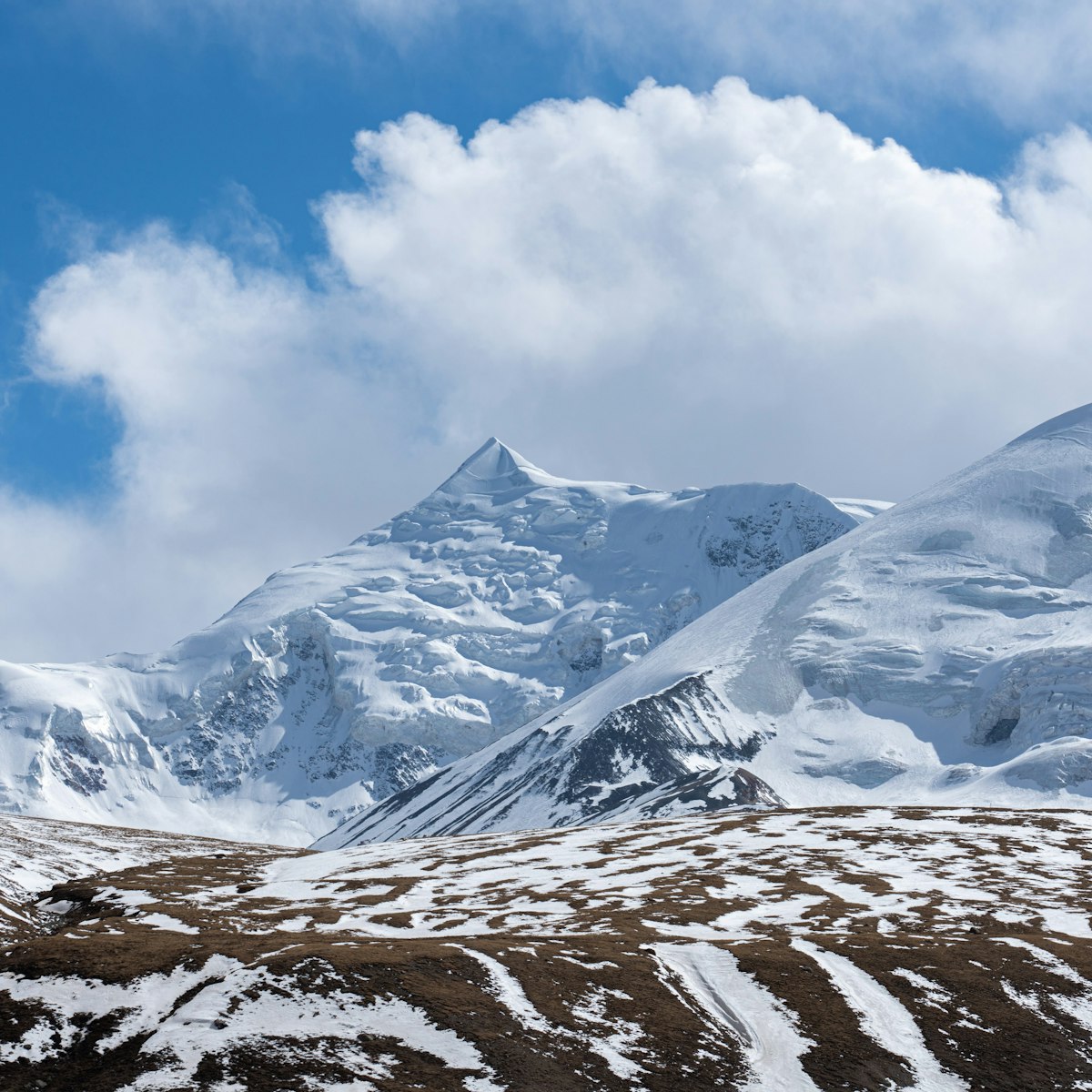 Close-up view of Mount Amnye Machen and its 6282m peak of Machen Kangri,   Amdo Tibet Region’s most sacred snow mountain. It's located in Qinghai Province, China. ; Shutterstock ID 2033099978; your: Bridget Brown; gl: 65050; netsuite: Online Editorial; full: POI Image Update