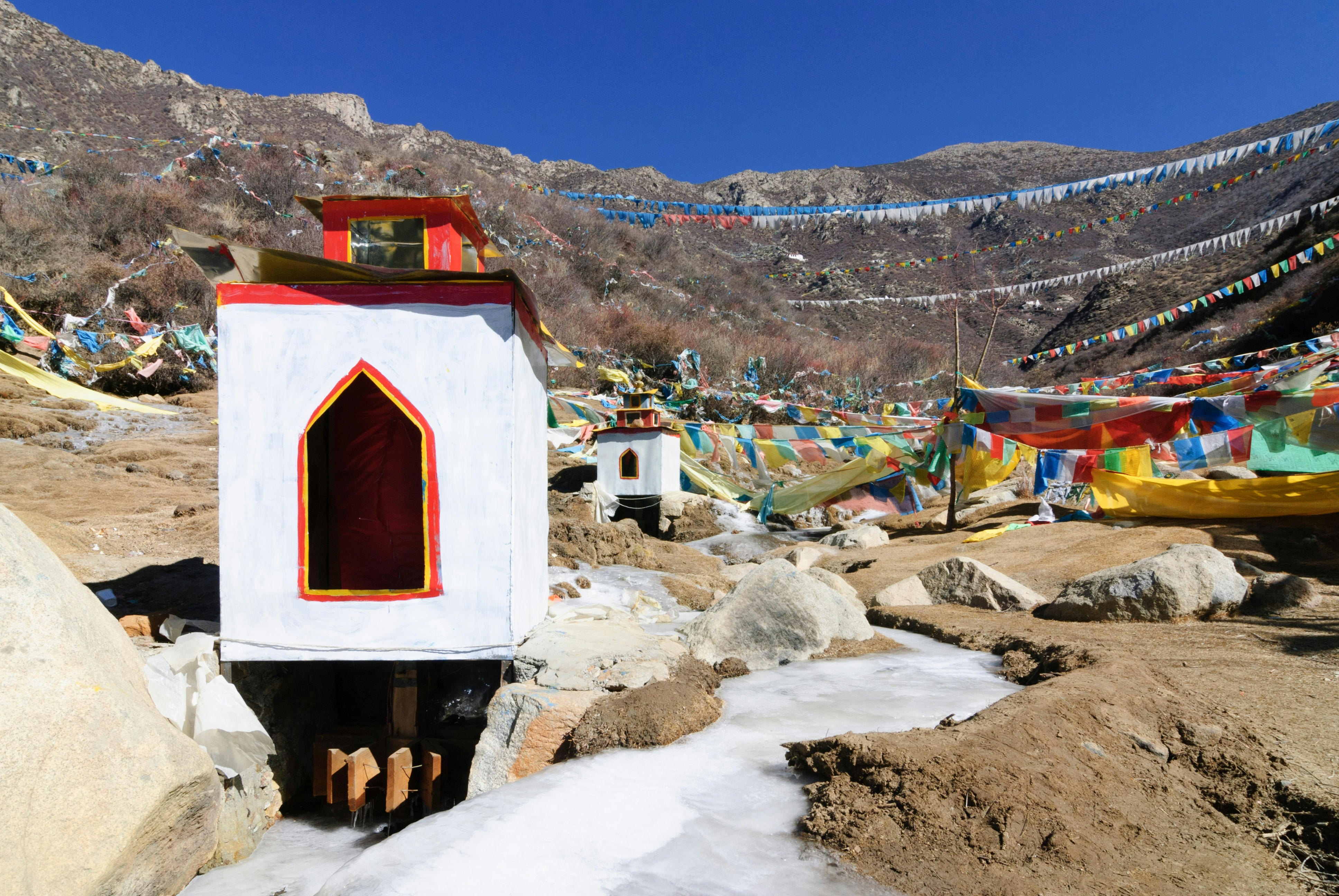 HE8AGD Samye: Prayer mills in the frozen water of a brook on the way to the Chim Puk hermitage, Tibet, China

Chim-puk Hermitage
