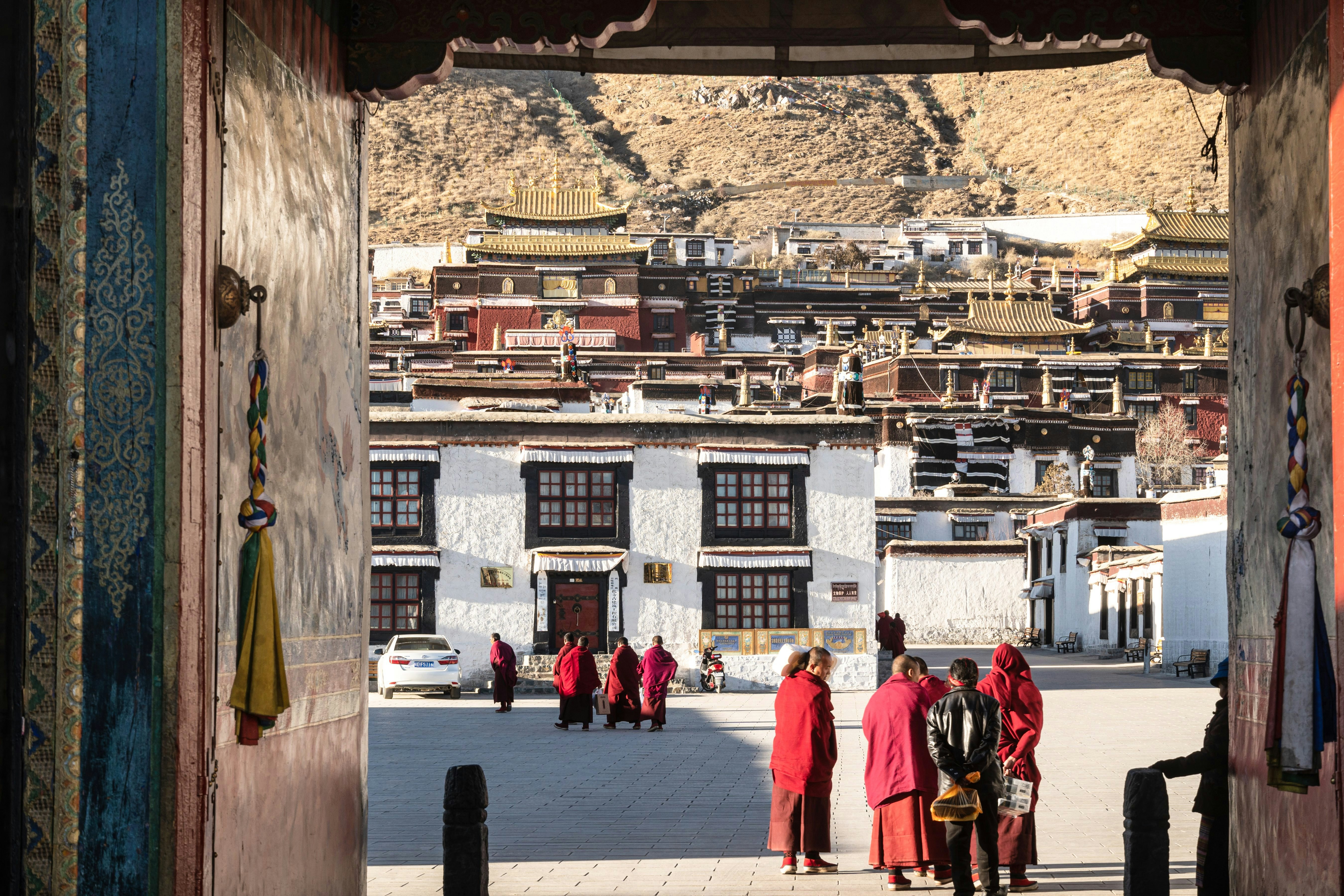 Shigatse, China - December 26 2018: Buddist monk walk in the traditional tashilhunpo monastery in Tibet province.