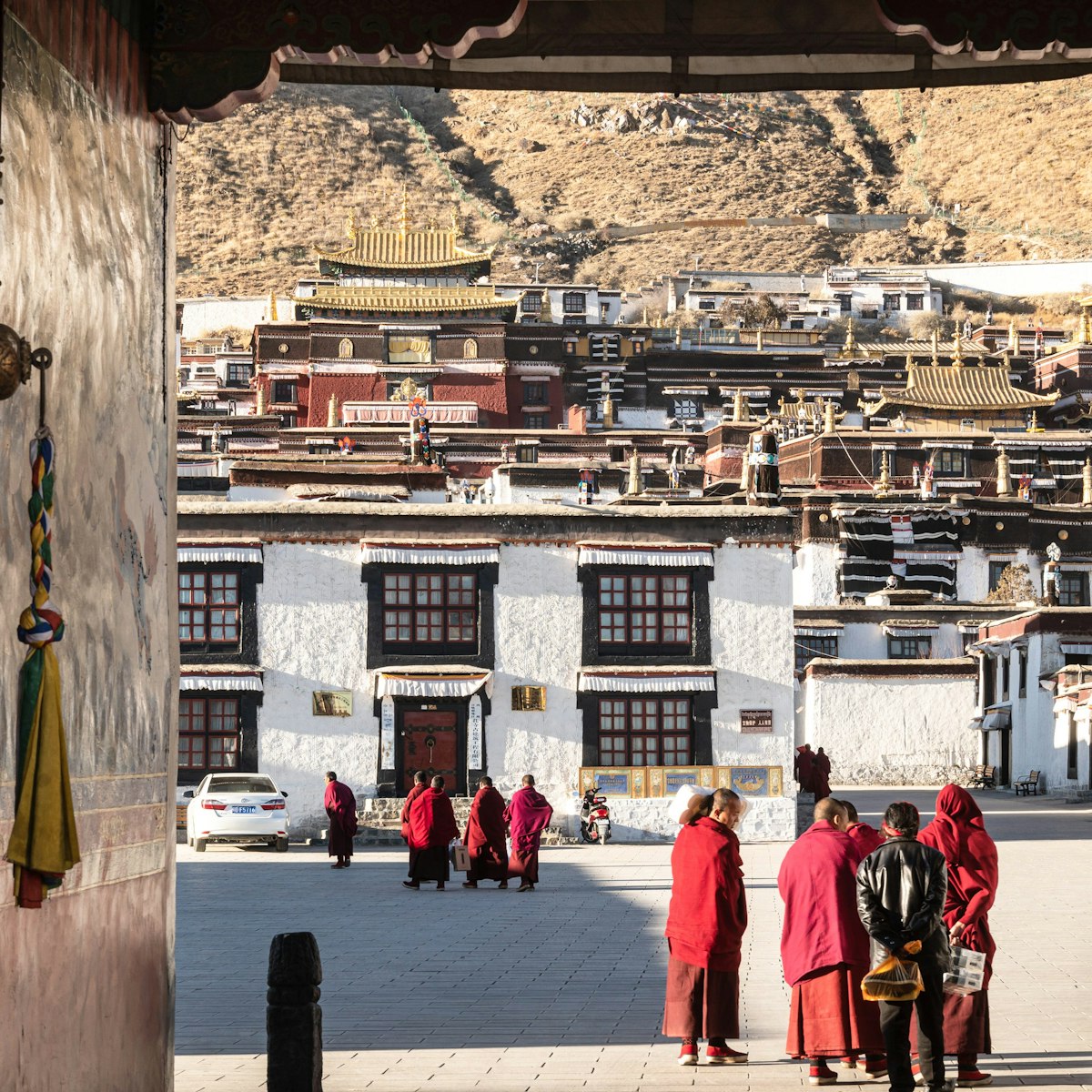 Shigatse, China - December 26 2018: Buddist monk walk in the traditional tashilhunpo monastery in Tibet province.