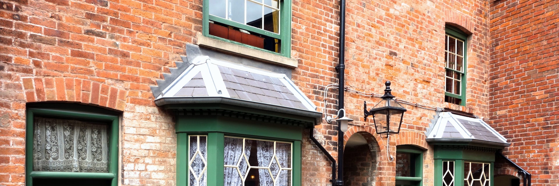 BIRMINGHAM, ENGLAND - JULY 4. The Birmingham Back-to-Backs are a block of Victorian dwellings which have been preserved and open to the public in the city centre. July 4 2016 in Birmingham, England.; Shutterstock ID 453993793; your: Bridget Brown; gl: 65050; netsuite: Online Editorial; full: POI Image Update