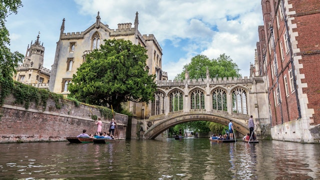Tourists under Bridge of Sighs at Saint John's College. Named for a famous Venice landmark, this circa-1831 covered arch bridge connects campus buildings, Cambridge, England, 21st of May 2017; Shutterstock ID 763444831; your: Bridget Brown; gl: 65050; netsuite: Online Editorial; full: POI Image Update