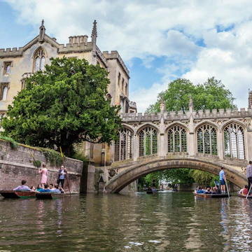 Tourists under Bridge of Sighs at Saint John's College. Named for a famous Venice landmark, this circa-1831 covered arch bridge connects campus buildings, Cambridge, England, 21st of May 2017; Shutterstock ID 763444831; your: Bridget Brown; gl: 65050; netsuite: Online Editorial; full: POI Image Update