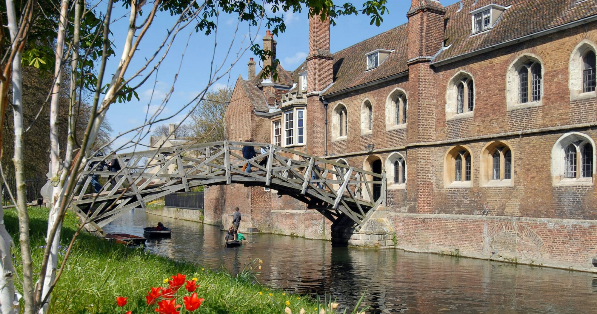 The Mathematical bridge at Queens college in Cambridge..Taken on a bright spring day.

Queens' College with bridge and flowers
