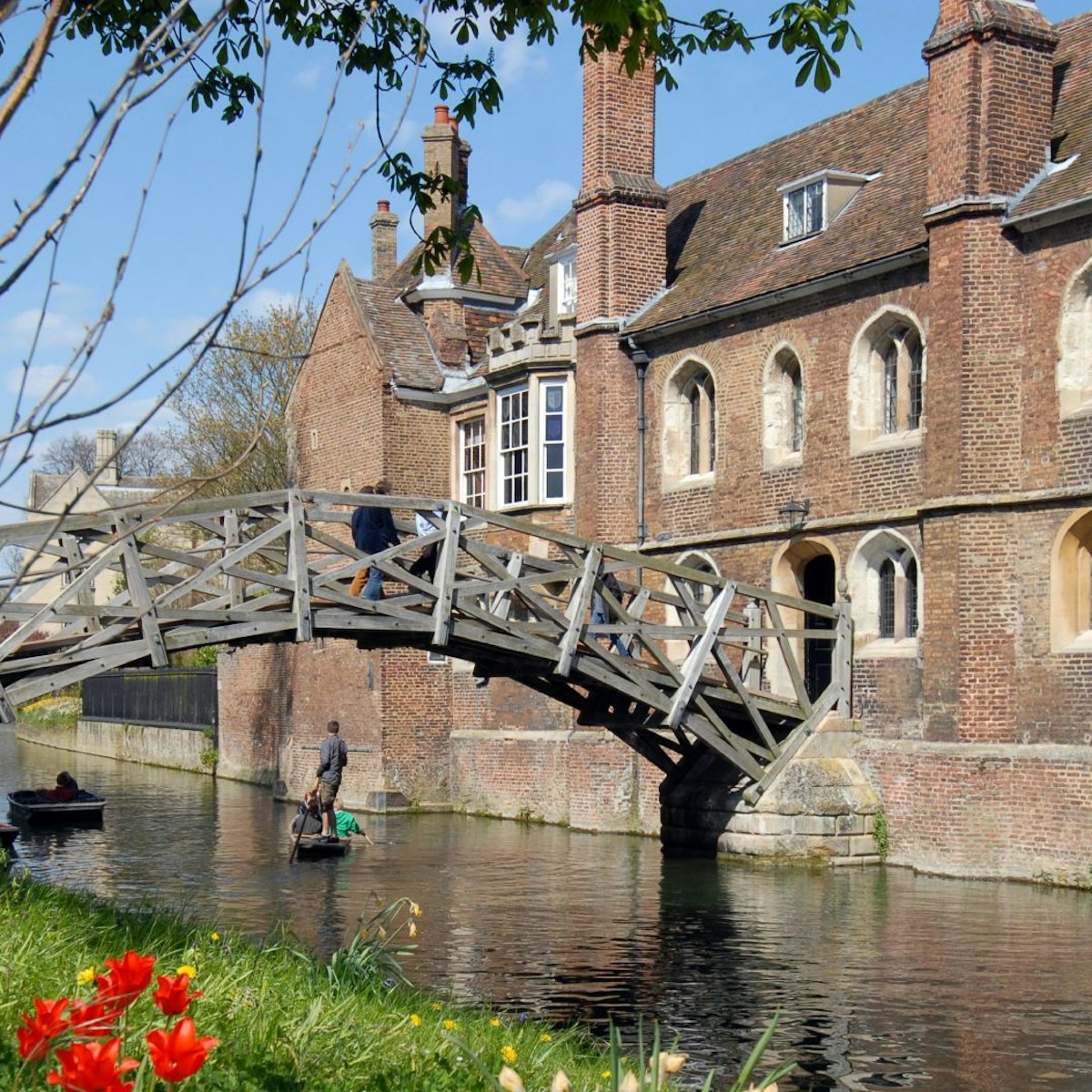 The Mathematical bridge at Queens college in Cambridge..Taken on a bright spring day.

Queens' College with bridge and flowers
