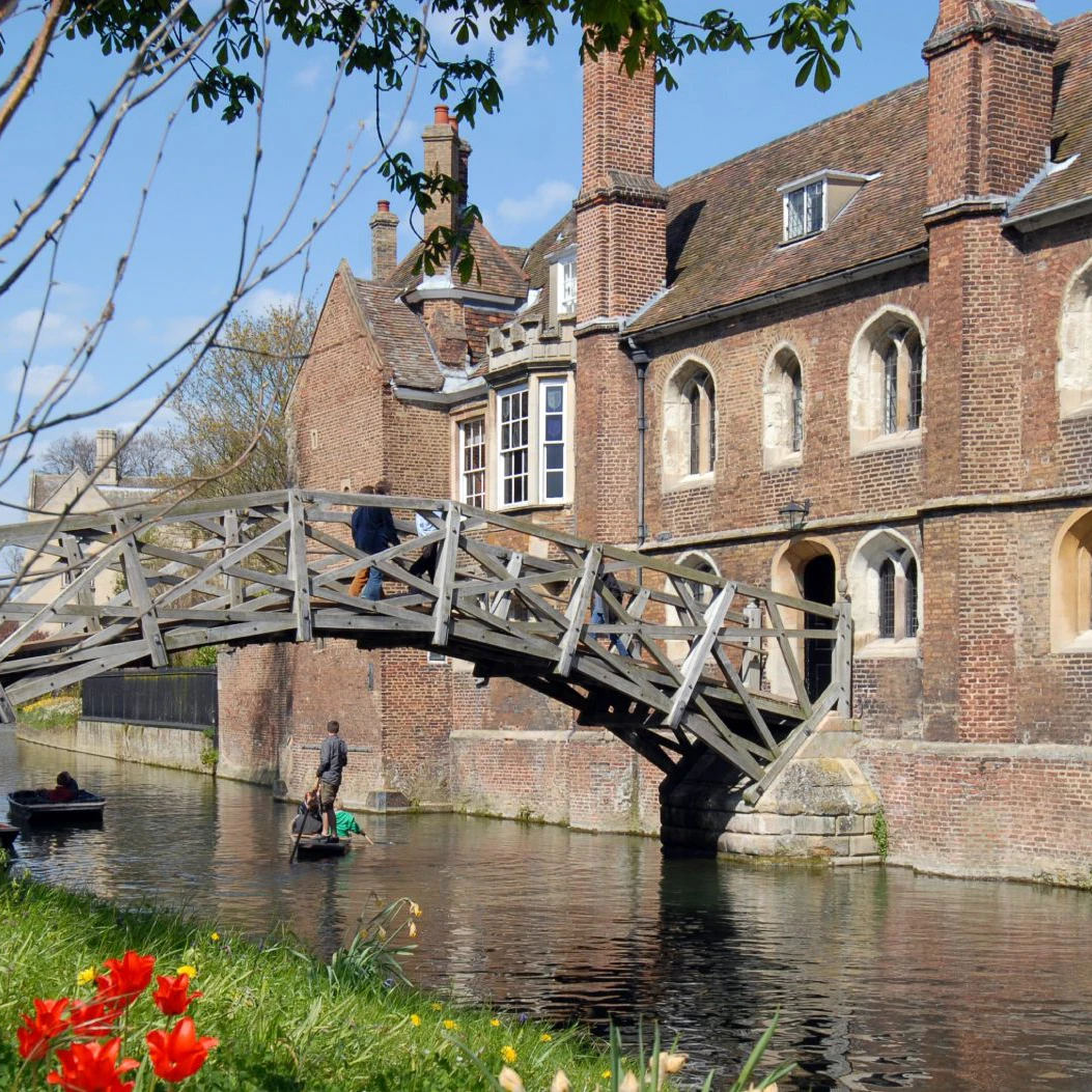 The Mathematical bridge at Queens college in Cambridge..Taken on a bright spring day.
Queens' College with bridge and flowers