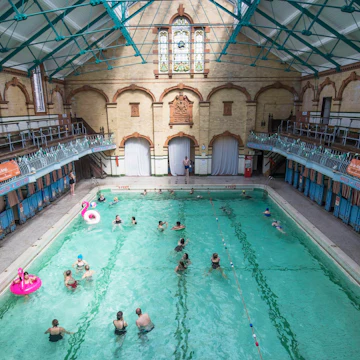 People Swimming in the Men's First Class Pool at Victoria Baths in Manchester, which is having an open swim day to raise funds for restoration work. - Image ID: J4XR5T
