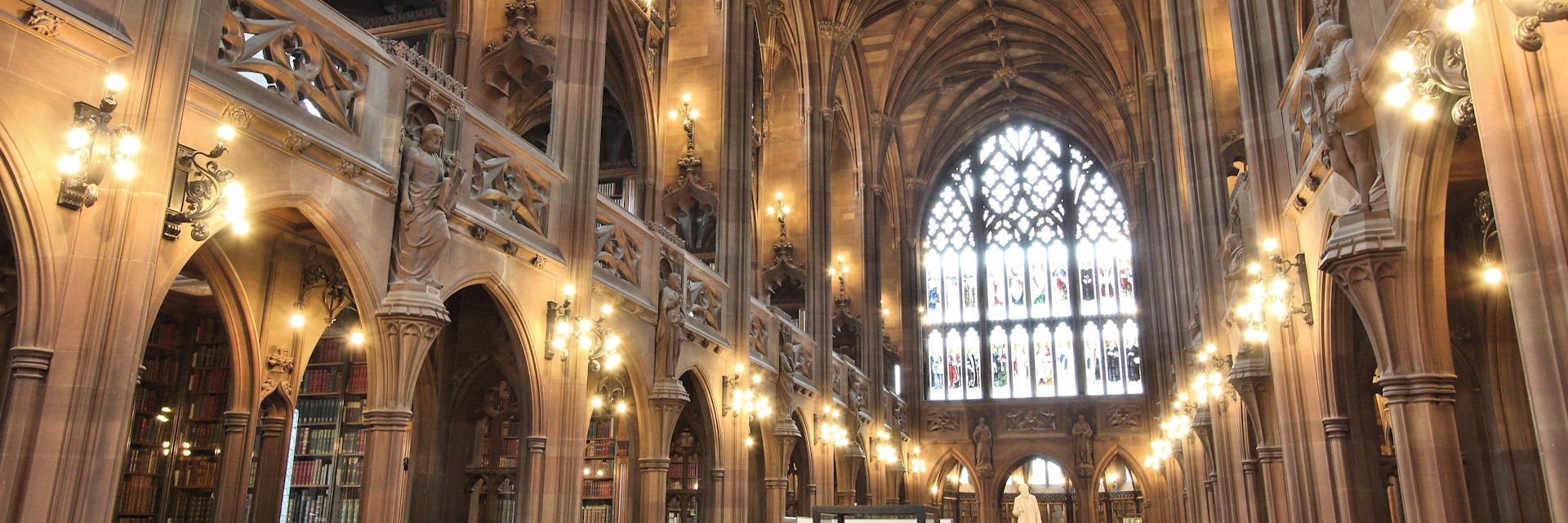 Manchester, United Kingdom - April 22, 2013: People visit John Rylands Library on April 22, 2013 in Manchester, UK. The library opened to public in 1900 and is a Grade I Listed building.