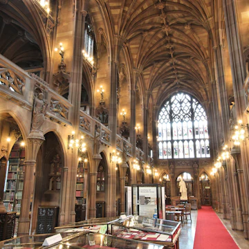 Manchester, United Kingdom - April 22, 2013: People visit John Rylands Library on April 22, 2013 in Manchester, UK. The library opened to public in 1900 and is a Grade I Listed building.