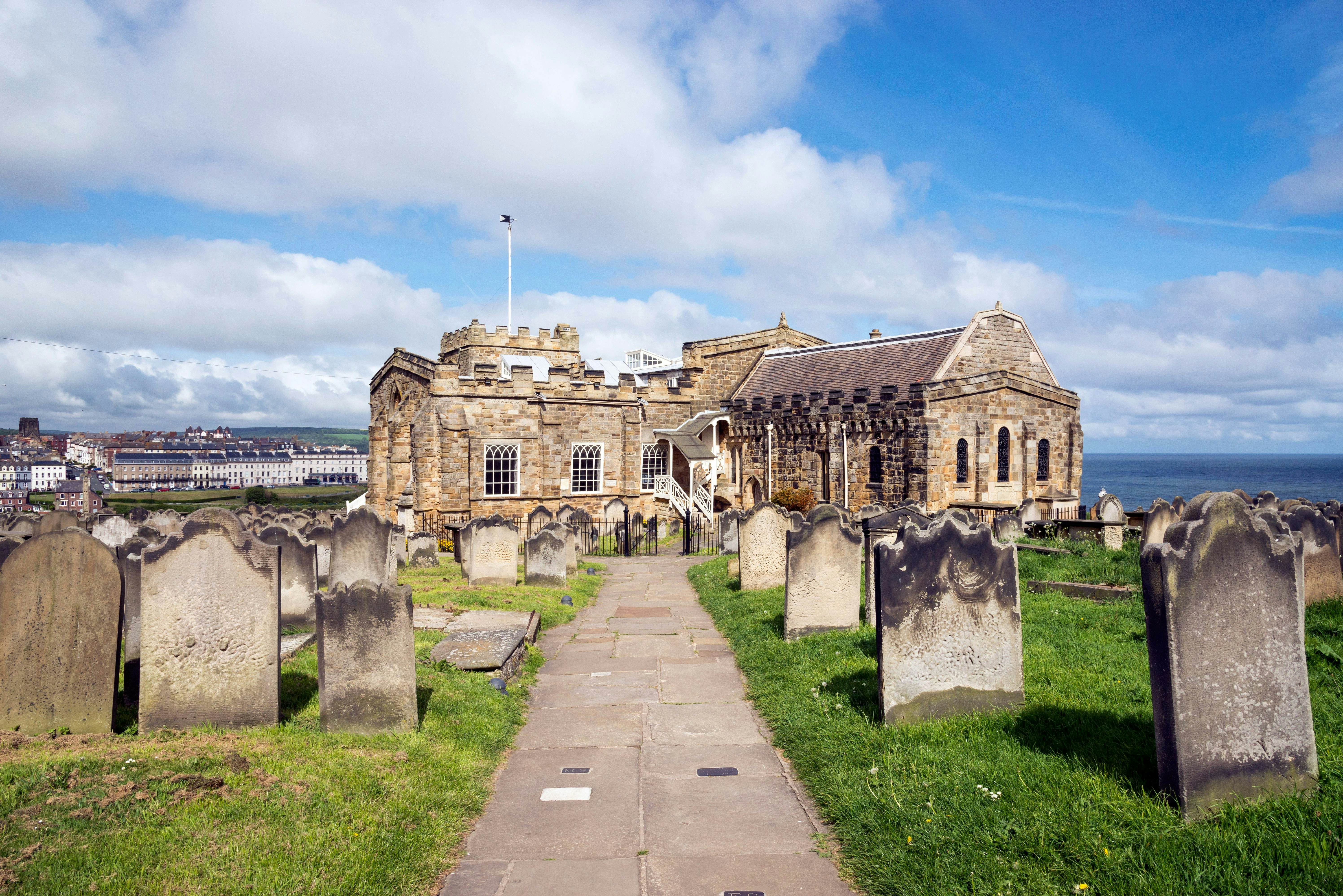 View of Whitby from St Mary's church, North Yorkshire, England - stock photo

Path in the graveyard beside this historic church on the cliff above the town of Whitby. A busy tourist destination with many attractions and a connection to the novel 'Dracula'.