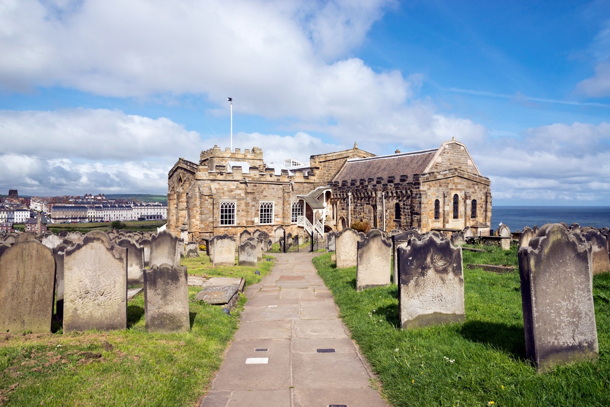 View of Whitby from St Mary's church, North Yorkshire, England - stock photo

Path in the graveyard beside this historic church on the cliff above the town of Whitby. A busy tourist destination with many attractions and a connection to the novel 'Dracula'.