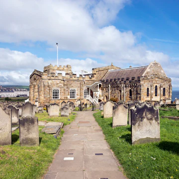 View of Whitby from St Mary's church, North Yorkshire, England - stock photo
Path in the graveyard beside this historic church on the cliff above the town of Whitby. A busy tourist destination with many attractions and a connection to the novel 'Dracula'.