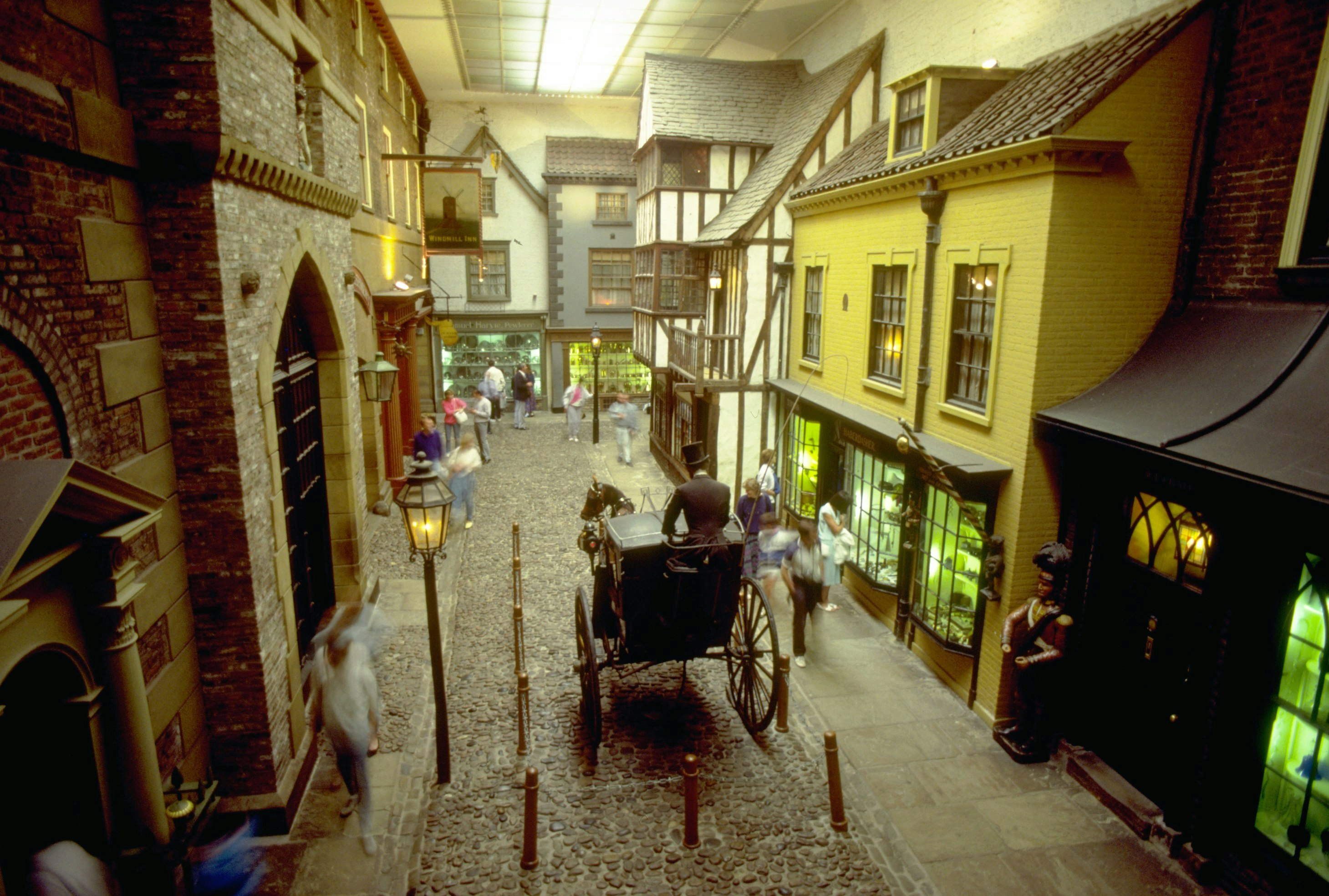 Visitors walk along model shops and carriages of a Victorian street scene in the York Castle Museum in York, England.
Victorian Street in York Castle Museum - stock photo

