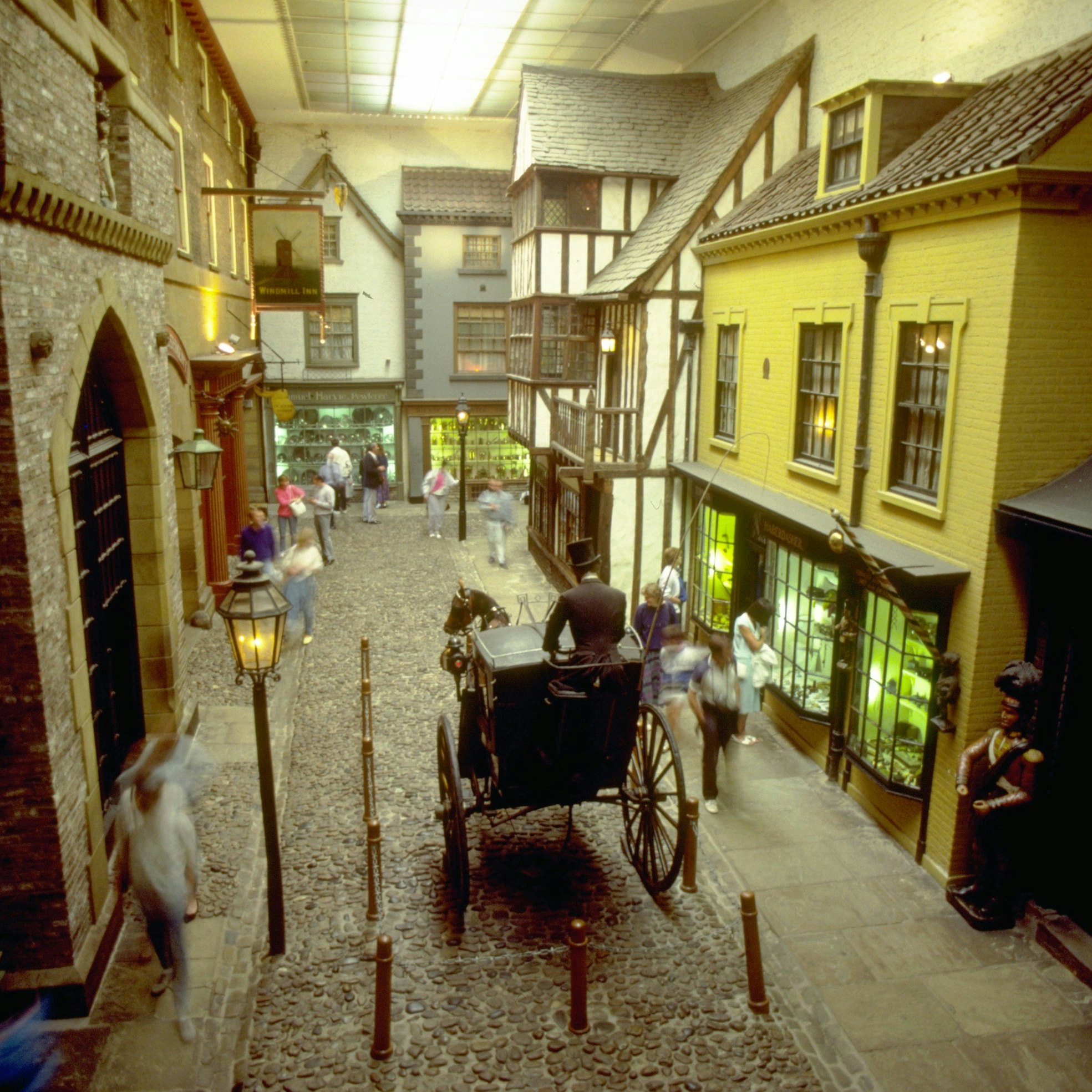 Visitors walk along model shops and carriages of a Victorian street scene in the York Castle Museum in York, England.
Victorian Street in York Castle Museum - stock photo


