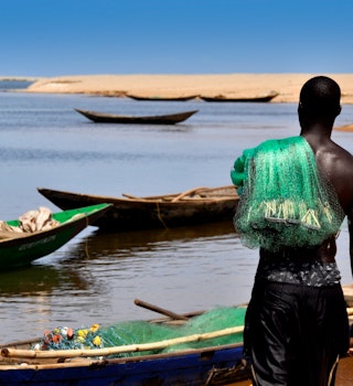 A fisherman on the shores of a beach in Ghana Renate Wefers / EyeEm
