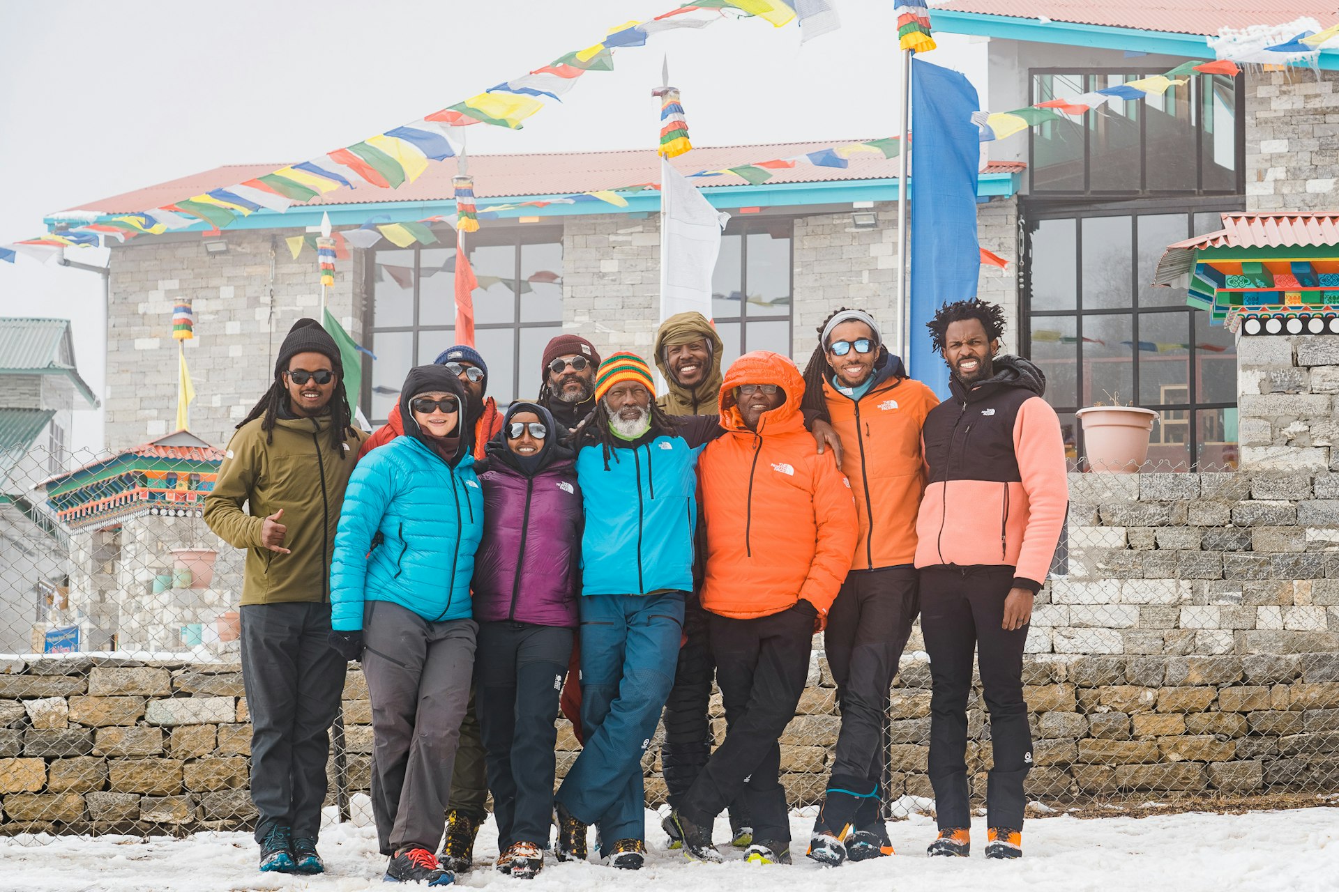 The Full Circle Everest team poses outside on a snowy day during a training trip to Nepal
