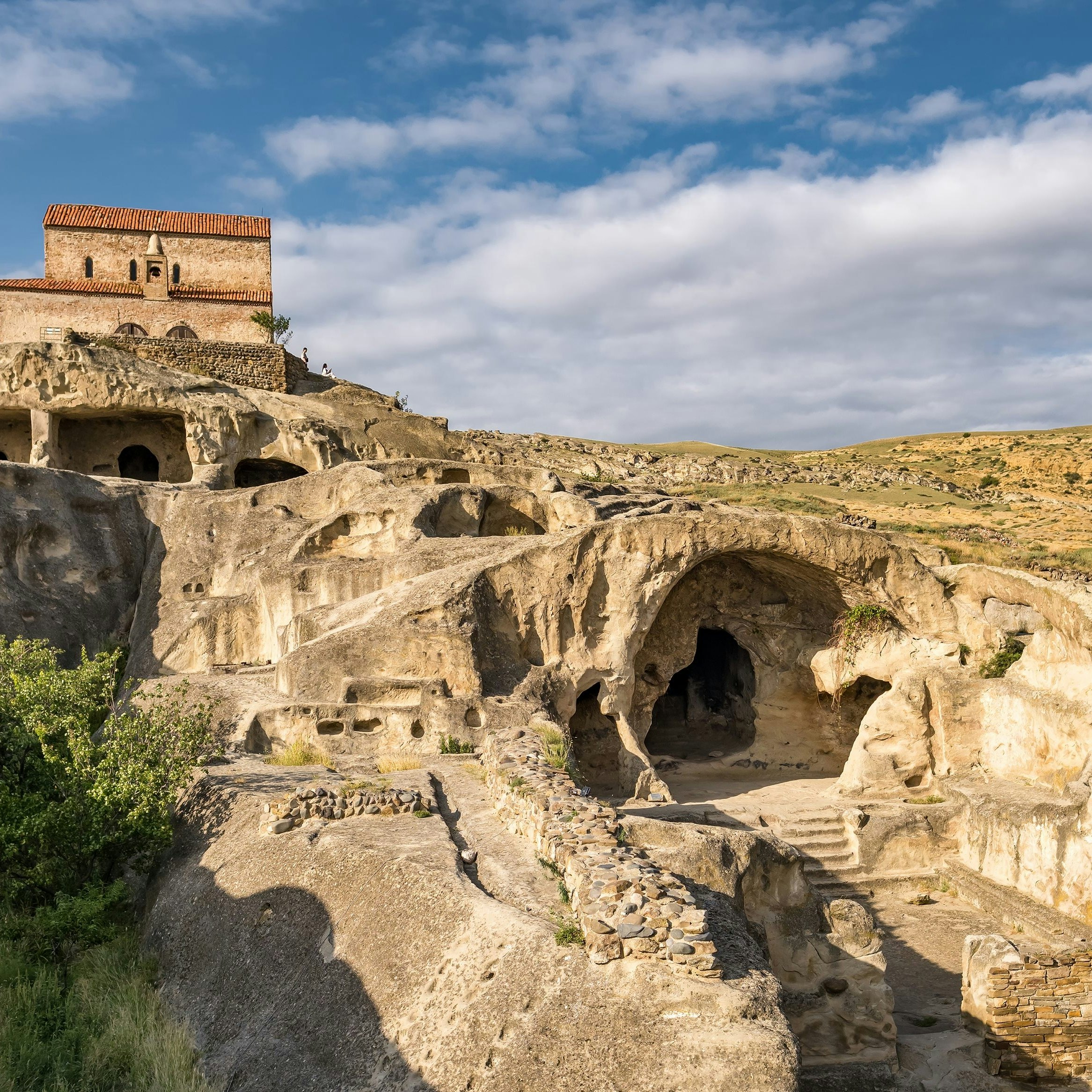 Uplistsikhe cave town near Gori city in Georgia. Ancient cave city Uplistsikhe at sunset in Georgia, UNESCO site.; Shutterstock ID 2108311661; your: Bridget Brown; gl: 65050; netsuite: Online Editorial; full: POI Image Update