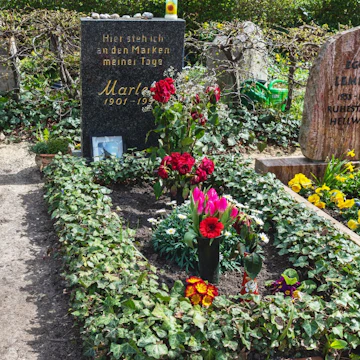 Berlin 2021: Marlene Dietrich honorary grave of the state of Berlin. The inscription reads "Hier steh ich an den Marken meiner Tage" (literally: "Here I am standing at the border stones of my days")