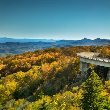 Linn Cove Viaduct Blue Ridge Parkway in autumn
Cars travel on the Linn Cove Viaduct highway road on the Grandfather Mountain along the Blue Ridge Parkway in autumn North Carolina USA