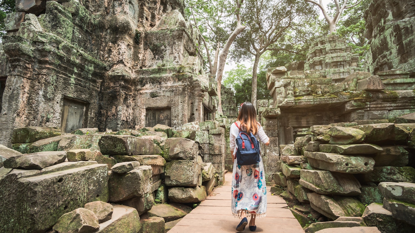 A woman exploring the ruins of Angkor, Cambodia