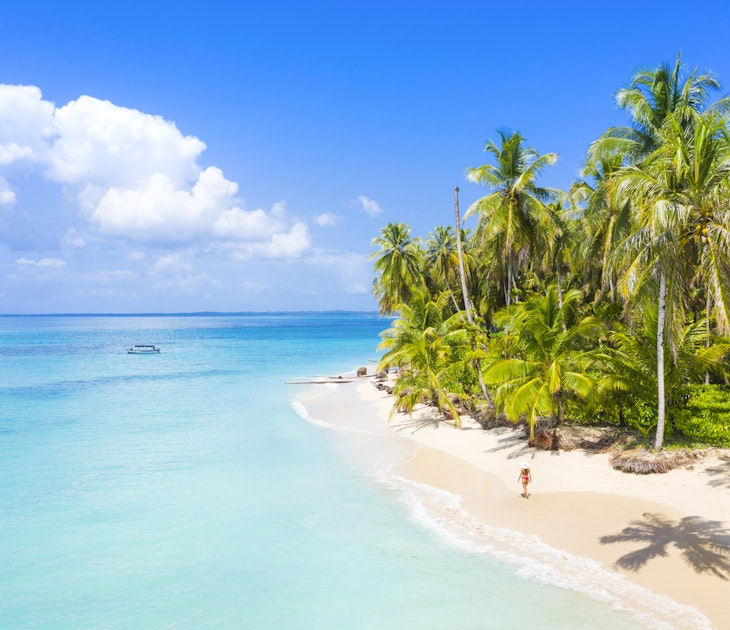 Woman walking on the beach in the Bocas del Toro islands