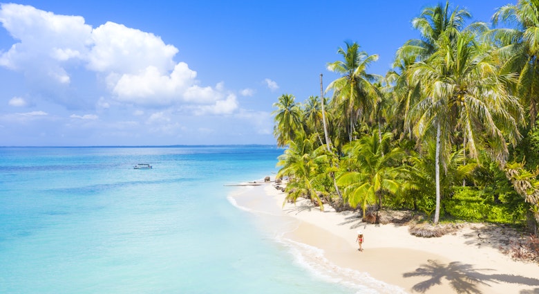 Woman walking on the beach in the Bocas del Toro islands