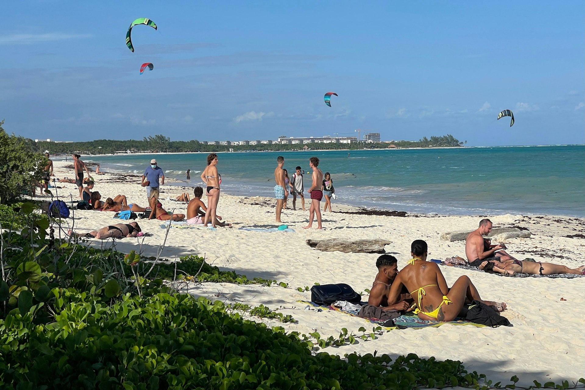 Visitors enjoy the white sands and blue waters at Punta Esmeralda in Playa del Carmen, Quintana Roo, Mexico