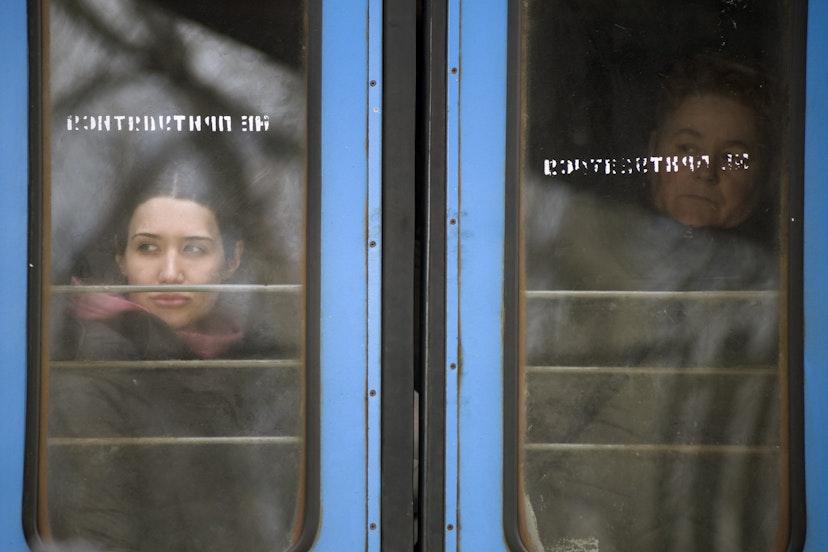 PRZEMYSL, PODKARPACKIE, POLAND - 2022/02/28: Ukrainian women are looking through out the train window at the station in Przemysl..On the fifth day of the Russian invasion on Ukraine, thousands of asylum seekers arrive by trains to Przemyl. Each train's capacity is estimated at two thousand people. (Photo by Attila Husejnow/SOPA Images/LightRocket via Getty Images)