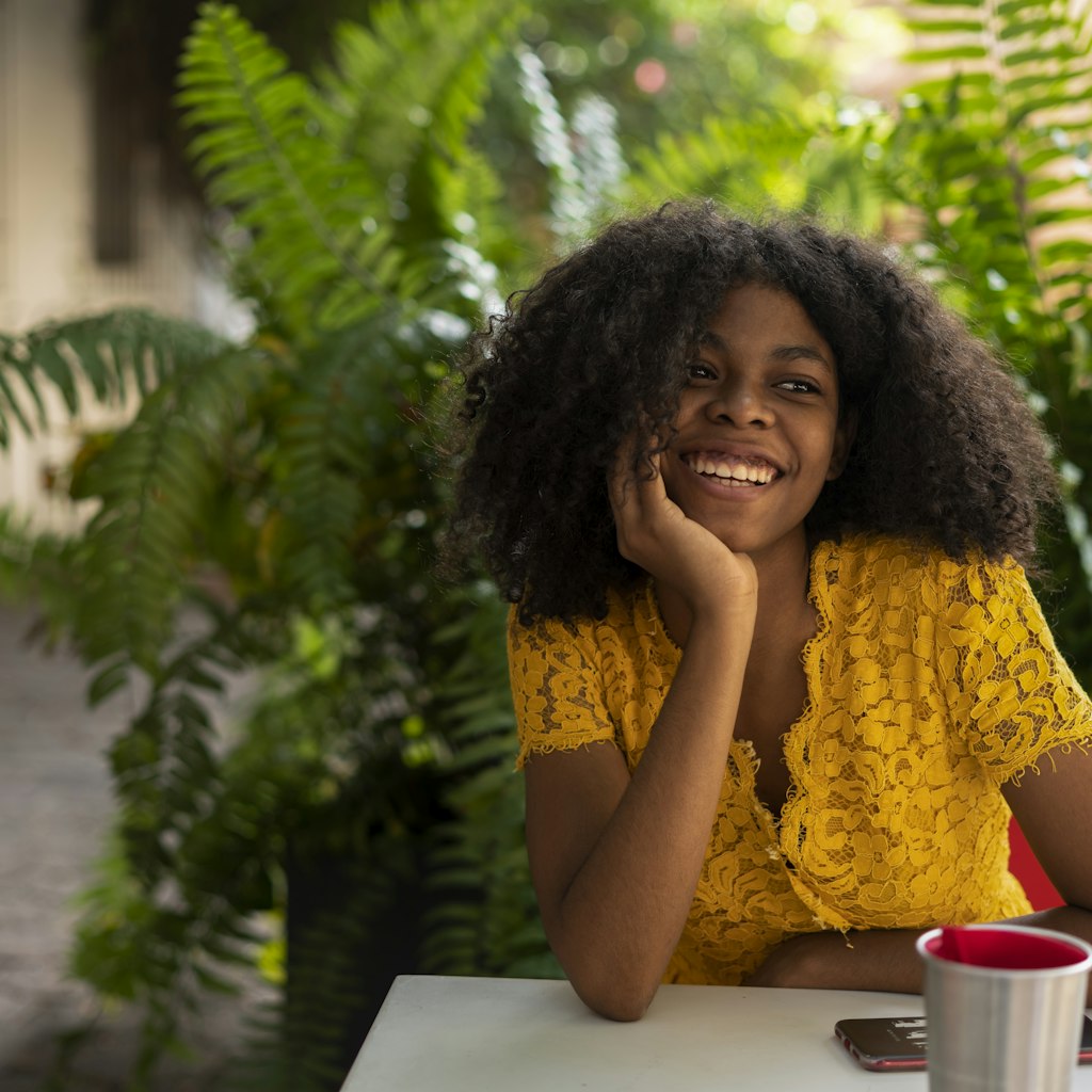 A young woman enjoying a drink in a Dominican Republic cafe