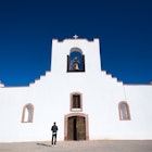 A man at the Socorro Mission on the Mission Trail near El Paso
