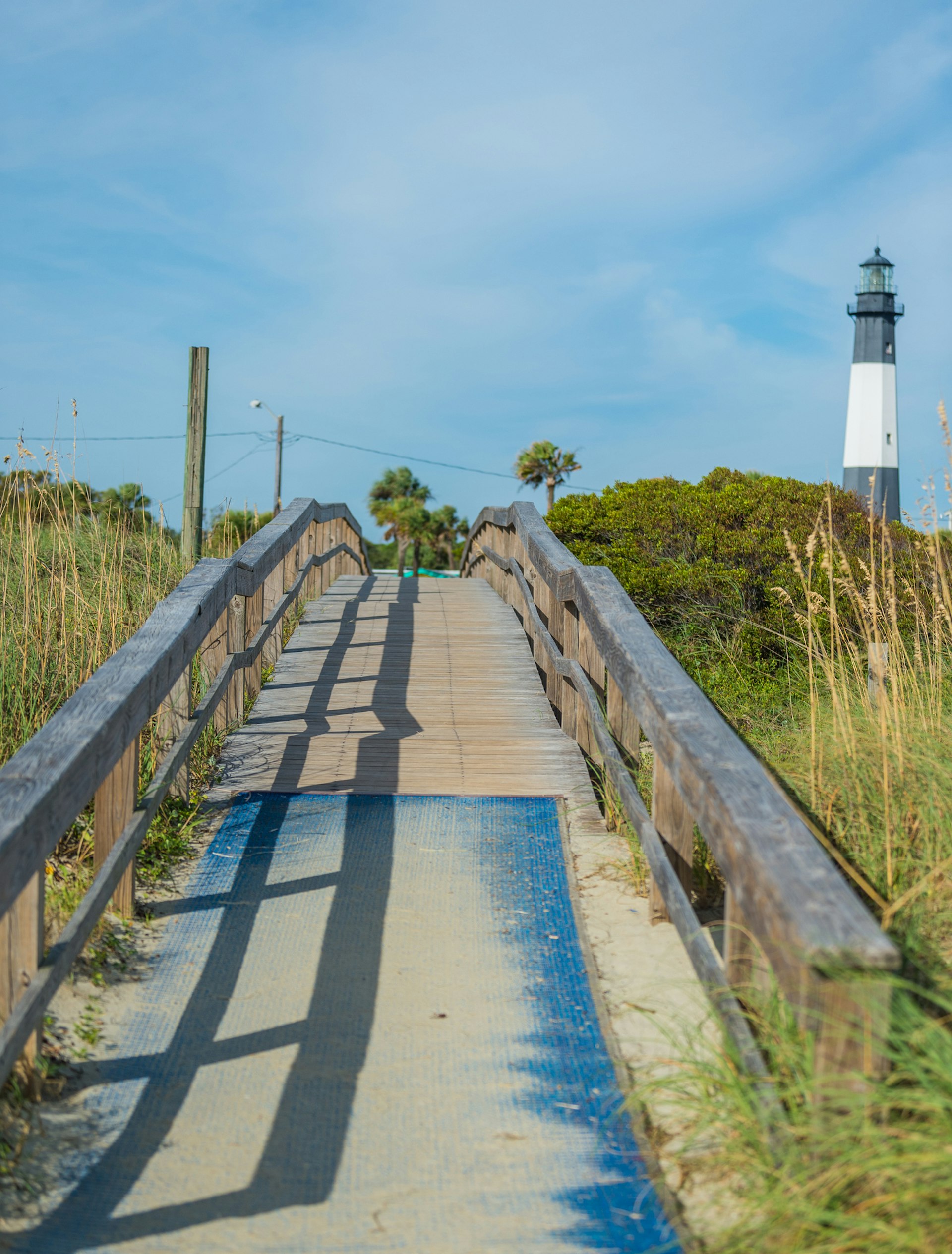 Path and wooden bridge leading from the beach to Tybee Island lighthouse