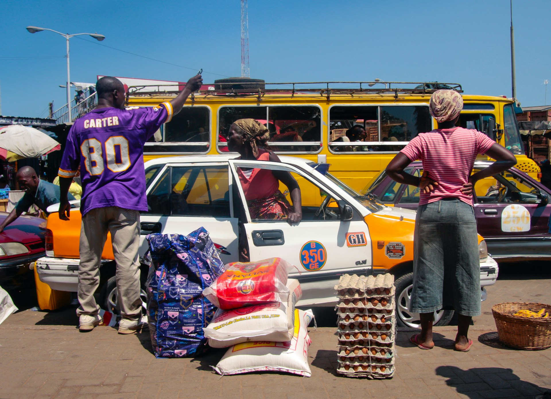 People waiting for bus at the main market in Accra