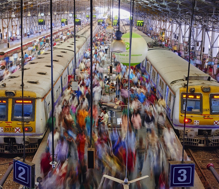 Passengers board trains at Mumbai's Chhatrapati Shivaji MaharajTerminus
