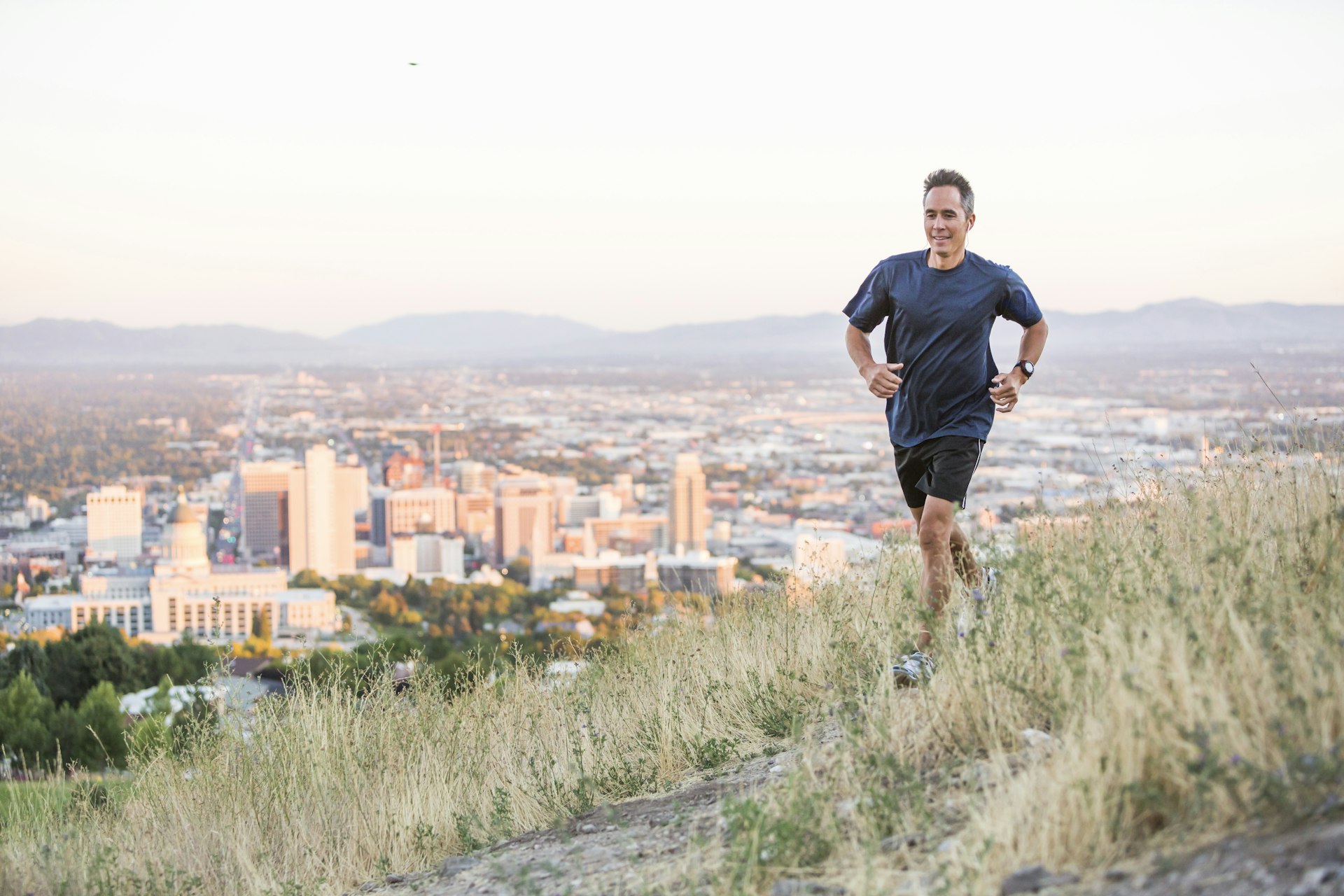Running on a hilltop over Salt Lake City, Utah, United States