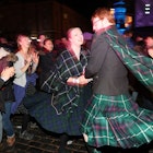 People ceilidh dance on the Royal Mile during the Hogmanay New Year celebrations in Edinburgh. (Photo by Andrew Milligan/PA Images via Getty Images)