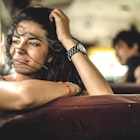 A young woman looking out of the window on a bus in Central America