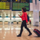 Woman travels through airport. 