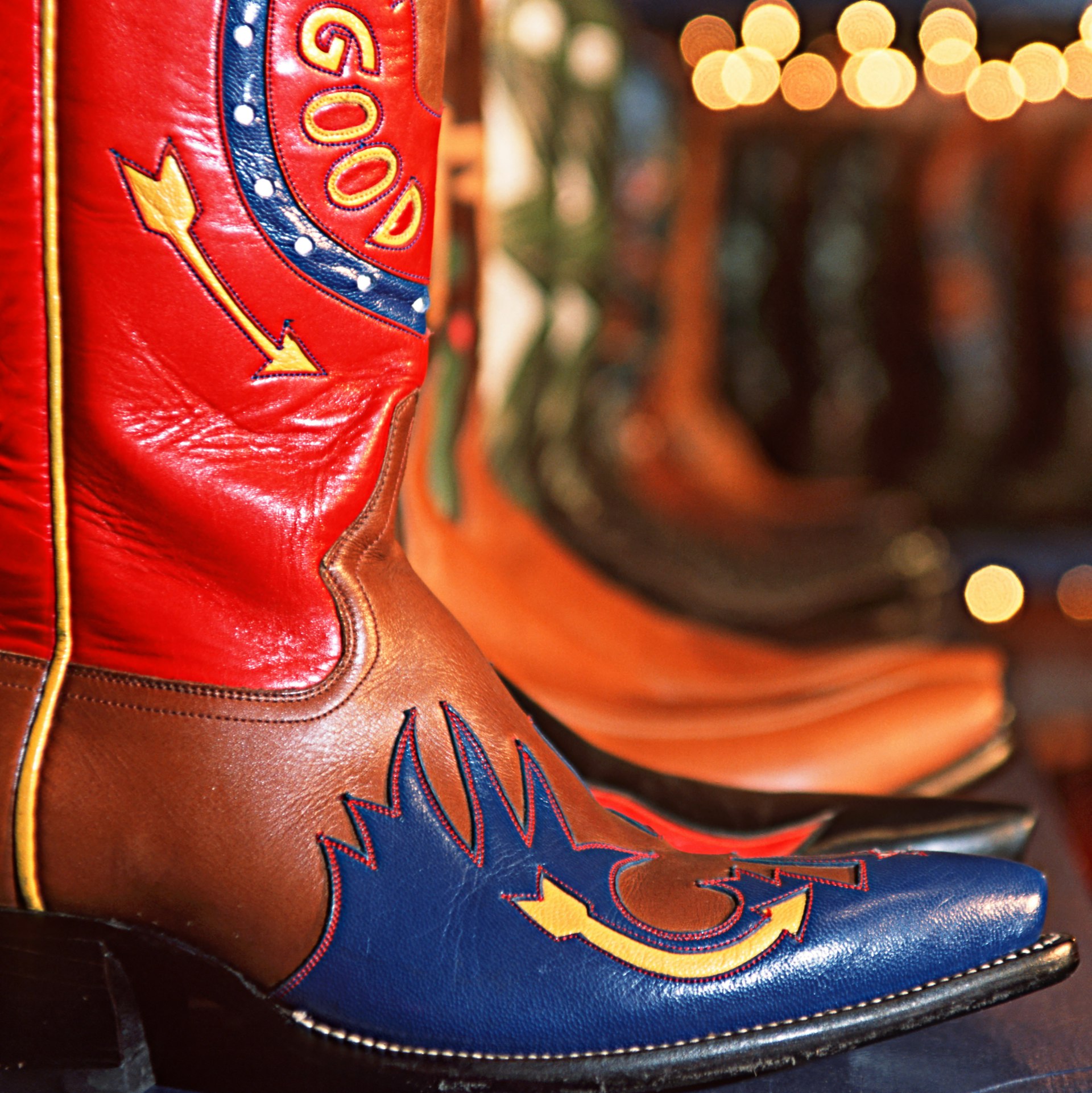 A pair of red and blue cowboy boots at Rocketbuster Boots, El Paso, Texas, USA
