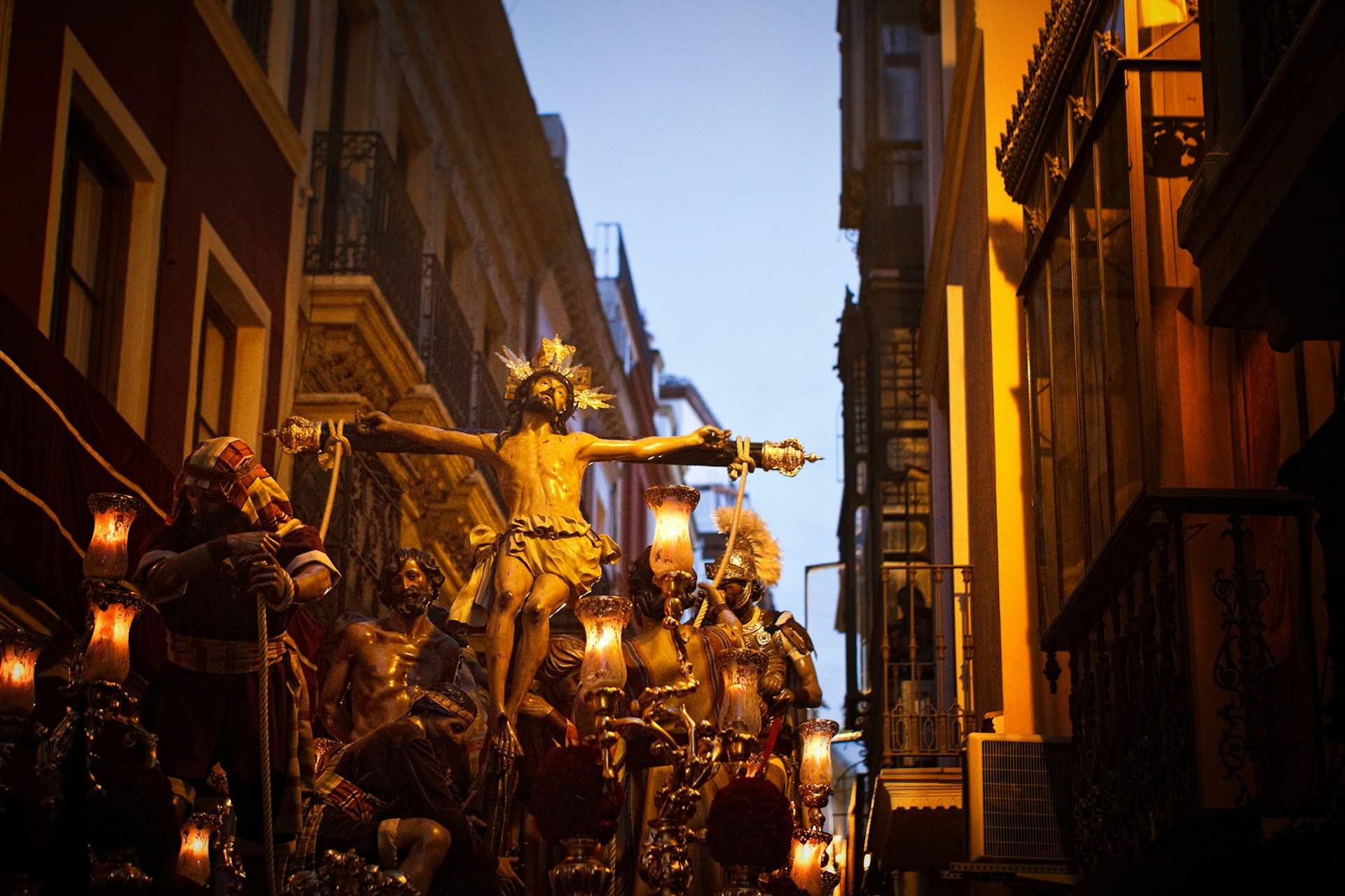 Procession at twilight during Semana Santa in Sevilla.