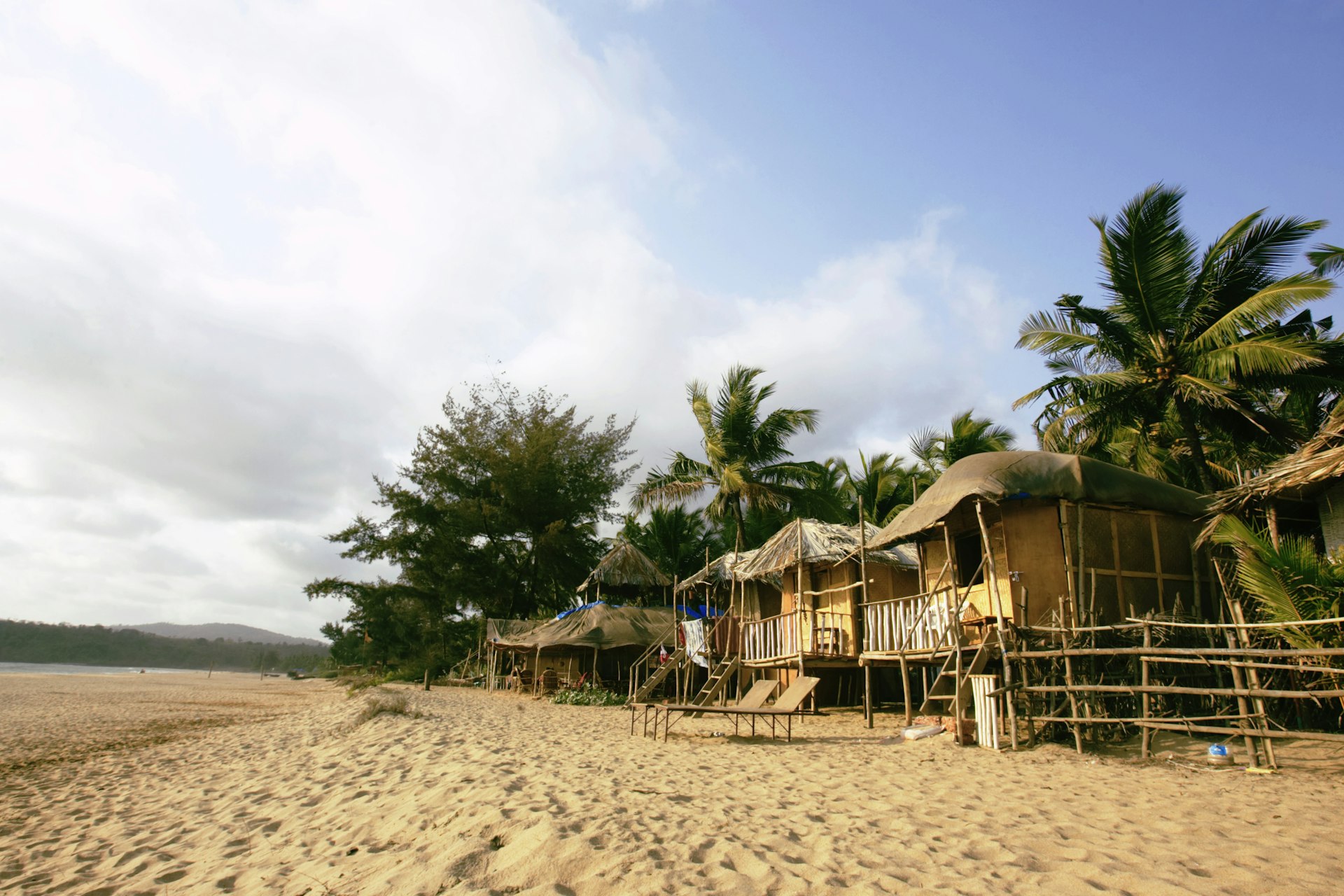 Beach huts on Agonda Beach on a sunny day