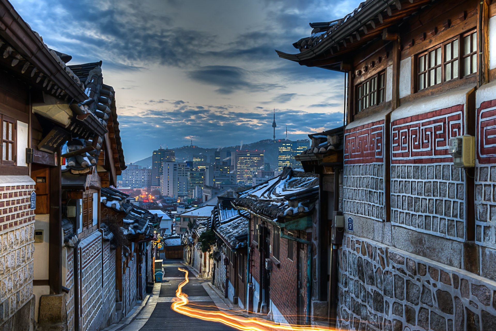Buildings in the traditional style pictured in narrow street at dawn in Bukchon Hanok Village, Seoul