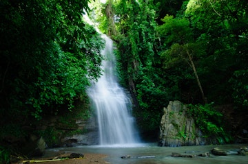 Shuknachara Waterfall, surrounded by dense green forest, is located in the Rangamati District of Chittagong.