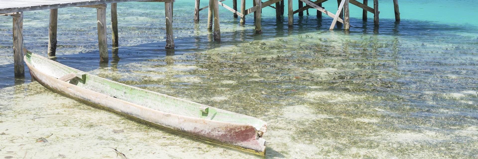 Wooden jetty in a tourist resort of the remote Togean Islands, Central Sulawesi, Indonesia.