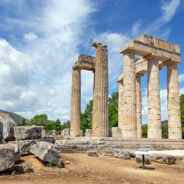 The Temple of Zeus built around 330 BC is a Doric peripteral temple consisting of 32 limestone outer columns (6 by 12 columns) and the construction is unusual as it included all three Greek architectural forms, the Doric, the Corinthian, and the Ionic.