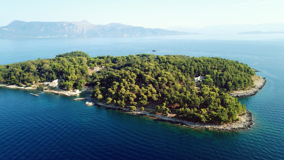 Aerial drone bird's eye view photo of iconic historical small island of Vidos a few nautical miles away from Corfu old town, Corfu island, Ionian, Greece; Shutterstock ID 1201132525; your: Bridget Brown; gl: 65050; netsuite: Online Editorial; full: POI Image Update