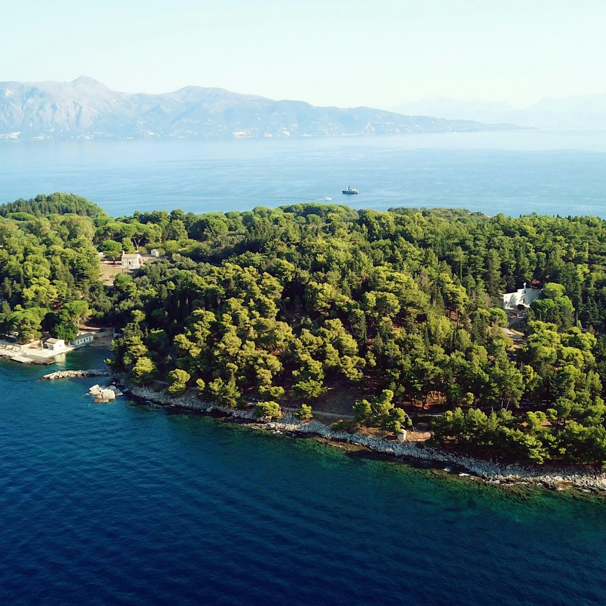 Aerial drone bird's eye view photo of iconic historical small island of Vidos a few nautical miles away from Corfu old town, Corfu island, Ionian, Greece; Shutterstock ID 1201132525; your: Bridget Brown; gl: 65050; netsuite: Online Editorial; full: POI Image Update