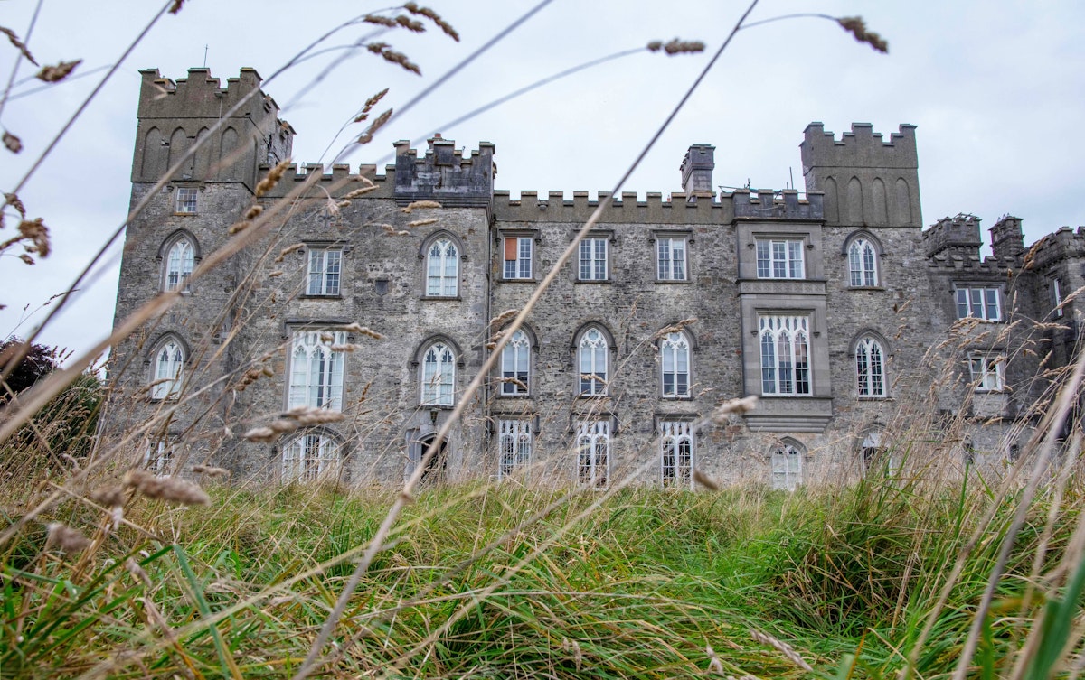 IRELAND-ENVIRONMENT-CLIMATE-NATURE
A picture shows Dunsany Castle, the seat of Randal Plunkett, Baron of Dunsany, in Dunsany, northwest of Dublin, Ireland, on October 13, 2021. - Randal Plunkett, the 21st Baron of Dunsany, strides out of his Irish castle in a t-shirt bearing the name of the US death metal band "Cannibal Corpse" in bloody lettering. In the distance, a russet-coloured stag appears for a moment, bracketed by impossibly green trees, before dissolving into the 750 acres (300 hectares) of ancestral estate Plunkett has surrendered to the wilderness. - TO GO WITH AFP STORY BY JOE STENSON (Photo by Paul Faith / AFP) / TO GO WITH AFP STORY BY JOE STENSON (Photo by PAUL FAITH/AFP via Getty Images)